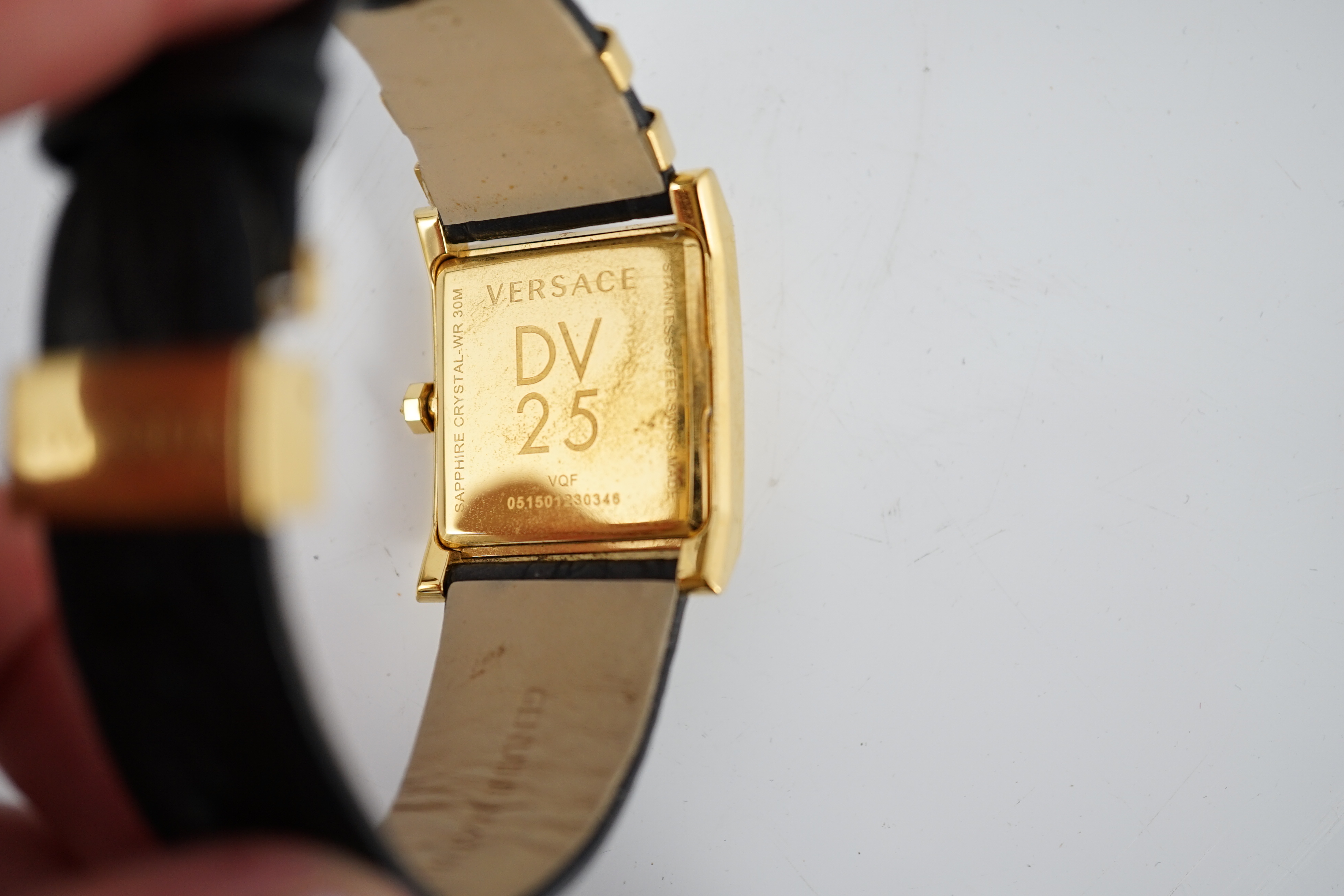 A Versace black yellow gold plated stainless steel and diamond VD25 wristwatch, case diameter 30mm, bracelet size 18cm